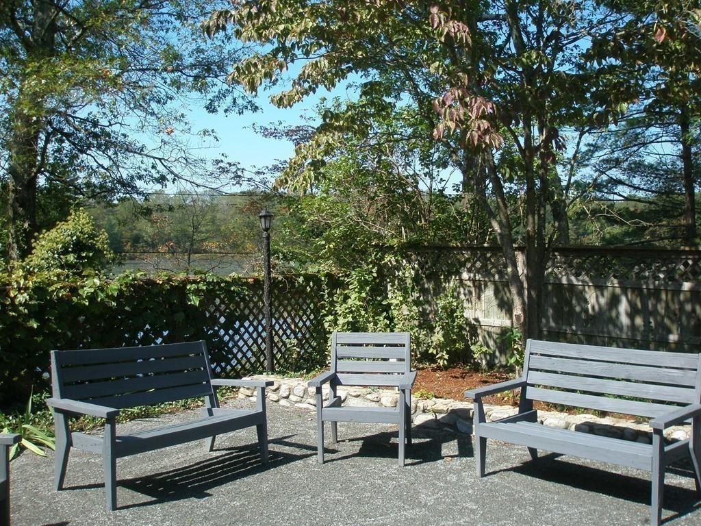 89 Lakeview Avenue Bellingham, MA 02019 - Photo 25 of 30 a view of a bench in a backyard