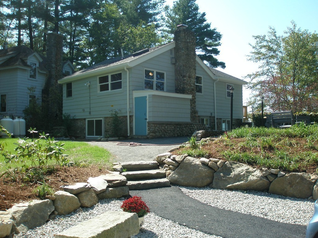 89 Lakeview Avenue Bellingham, MA 02019 - Photo 3 of 30 a view of a backyard with sitting area and garden
