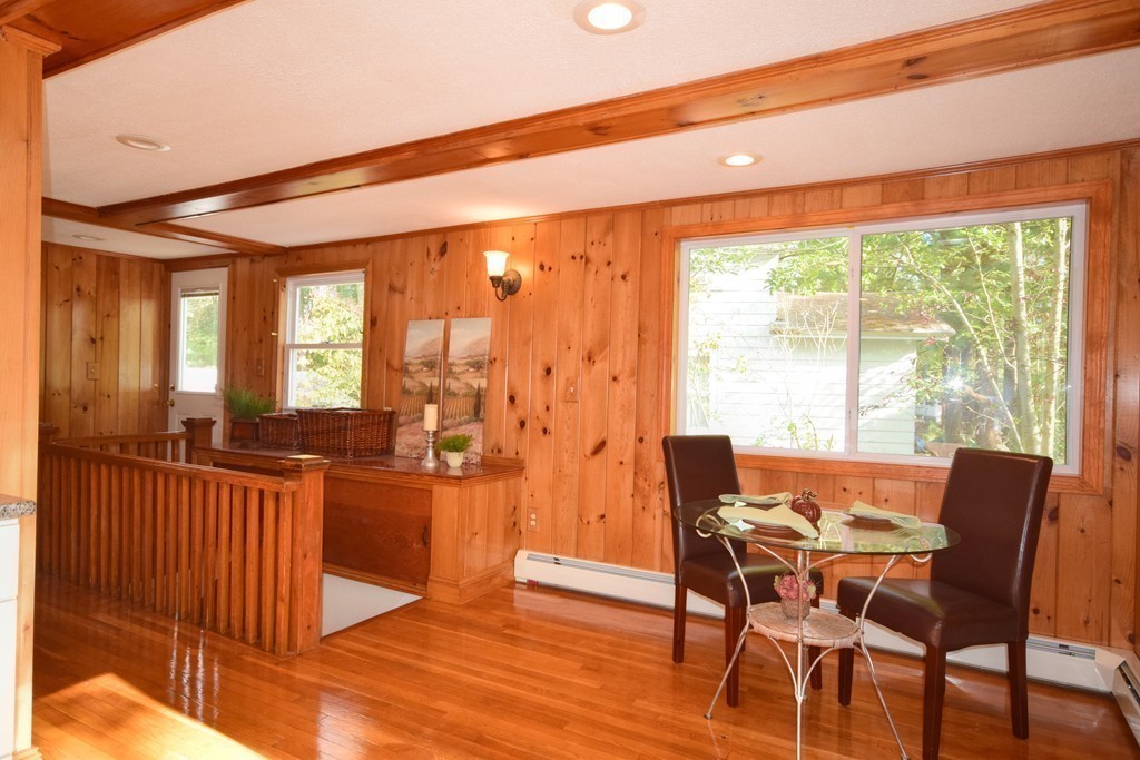 89 Lakeview Avenue Bellingham, MA 02019 - Photo 7 of 30 a dining room with furniture and large windows