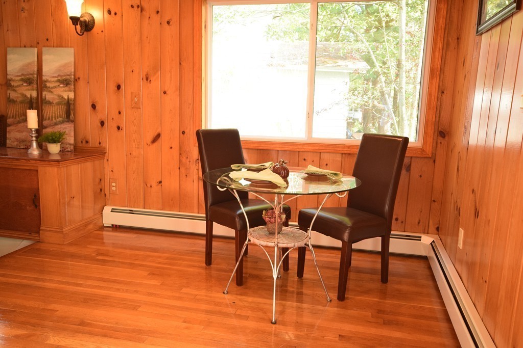89 Lakeview Avenue Bellingham, MA 02019 - Photo 8 of 30 a view of a dining room with furniture and wooden floor
