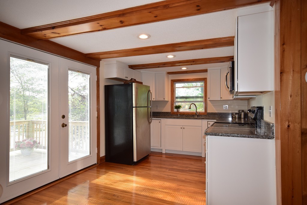 89 Lakeview Avenue Bellingham, MA 02019 - Photo 9 of 30 a kitchen with stainless steel appliances granite countertop a refrigerator and a sink