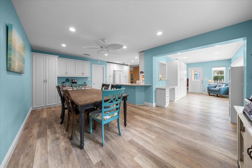 8720 Southwest 90th Street, Unit A Ocala, FL 34481 - Photo 19 of 71 a view of a dining room with furniture and wooden floor