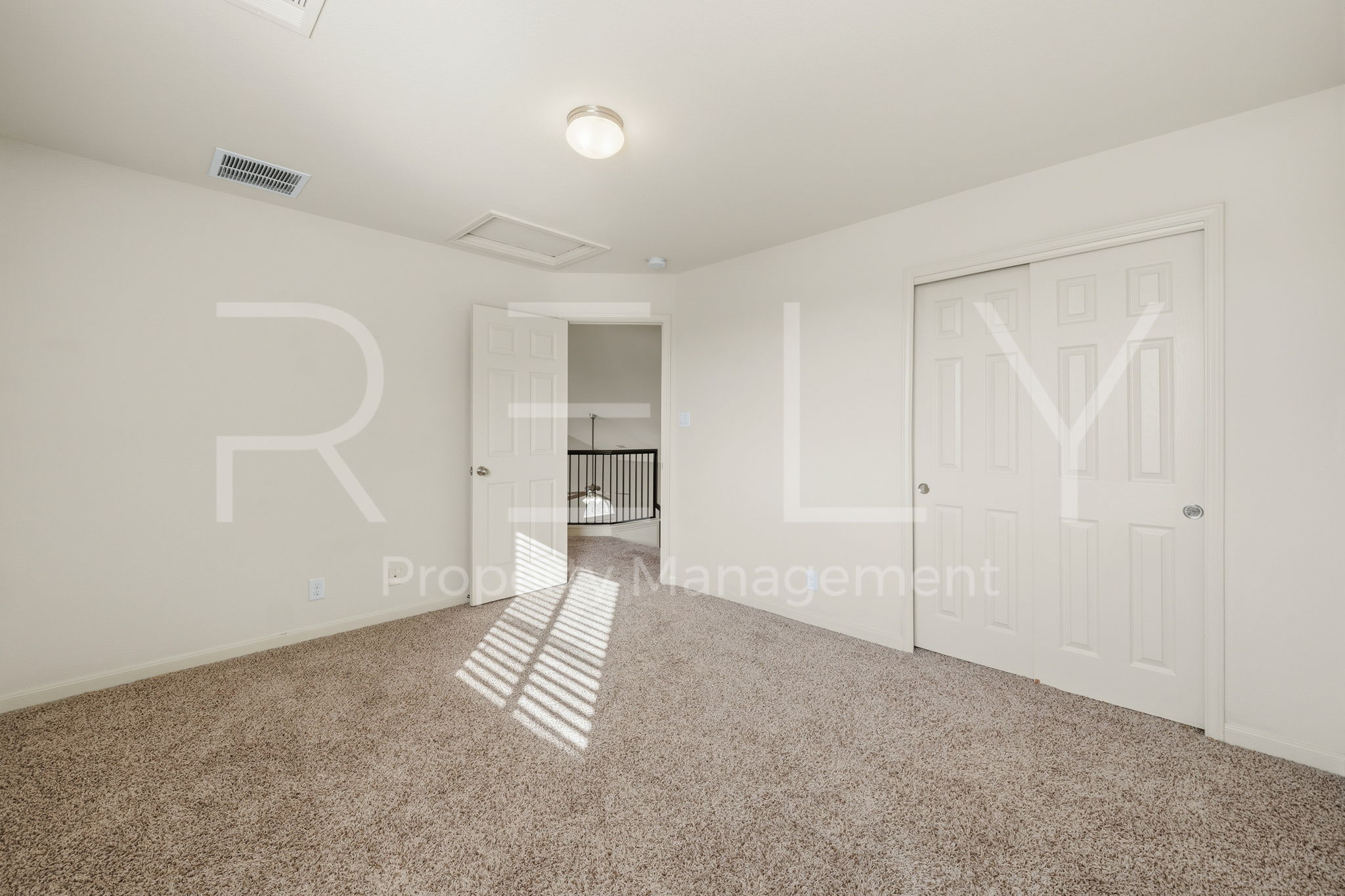 1405 Sunny Meadows Loop Georgetown, TX 78626 - Photo 30 of 40 Well-lit and inviting, this bedroom offers plush carpeting and convenient closet access.