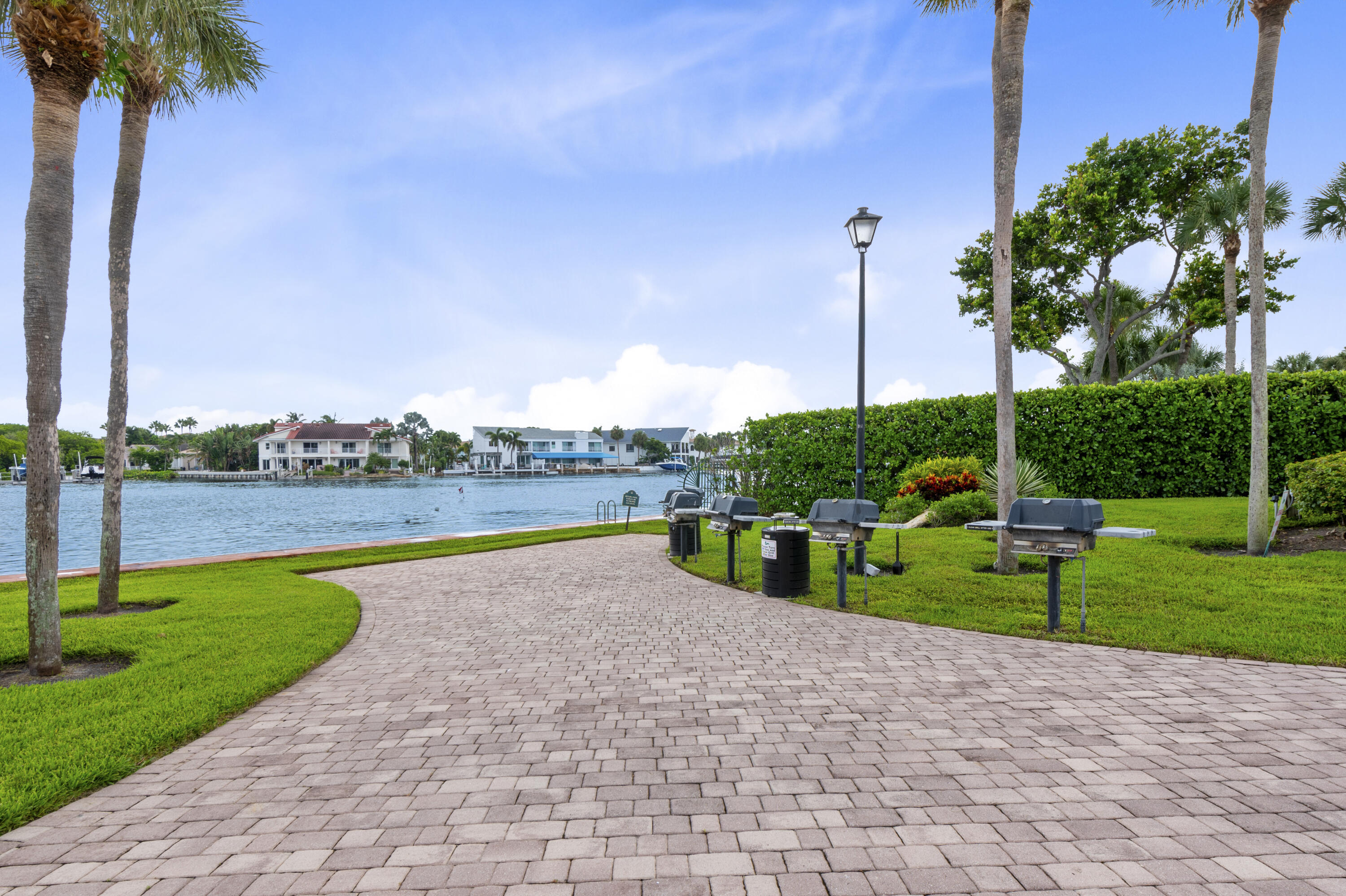 859 Jeffery Street, Unit 312 Boca Raton, FL 33487 - Photo 39 of 53 a view of a lake with a big yard