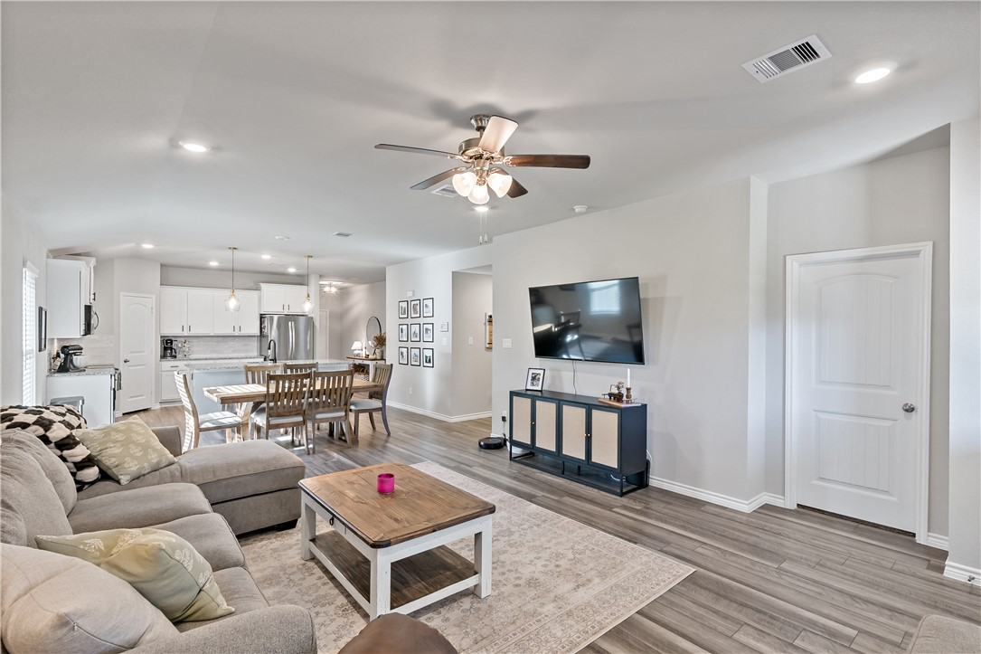 2135 Chief Street Bryan, TX 77807 - Photo 13 of 26 a living room with furniture and a flat screen tv