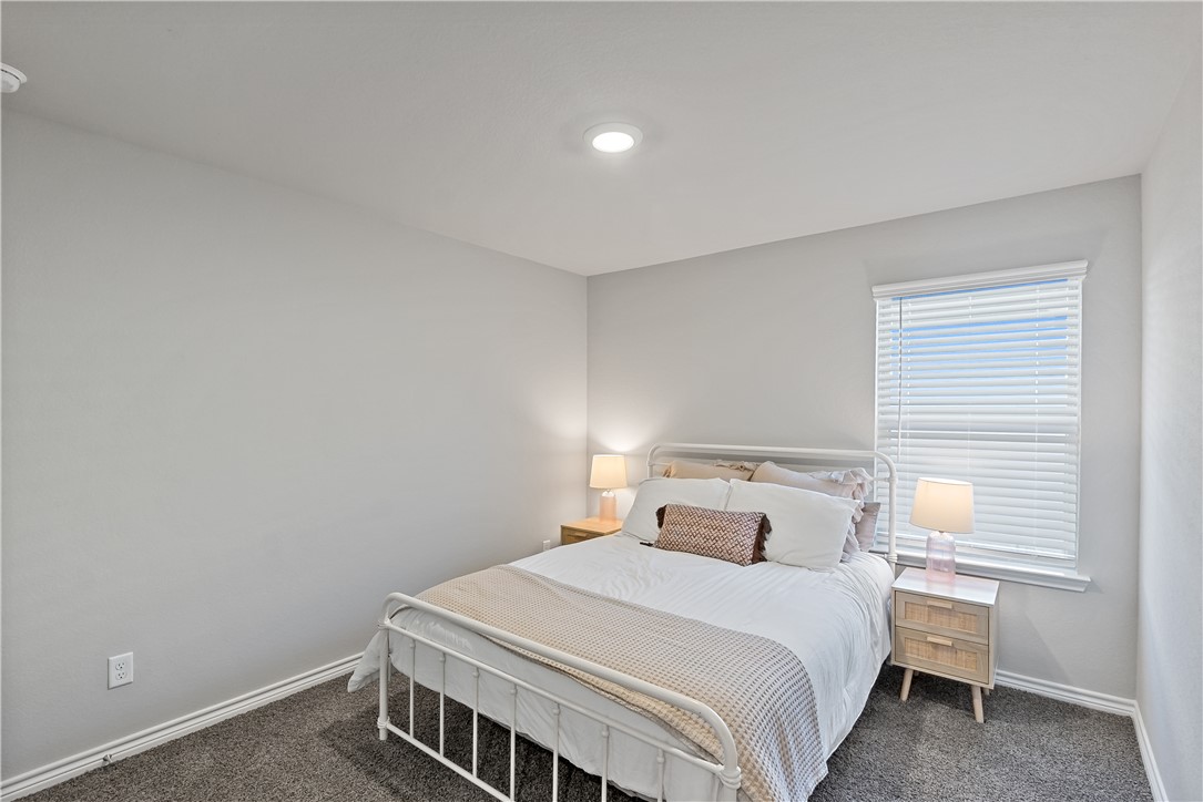 2135 Chief Street Bryan, TX 77807 - Photo 17 of 26 a bedroom with a bed and a window