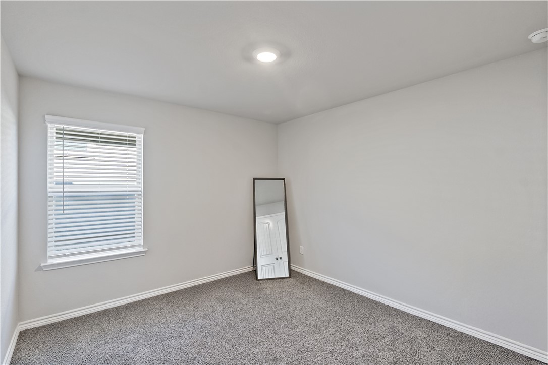 2135 Chief Street Bryan, TX 77807 - Photo 18 of 26 an empty room with windows and closet