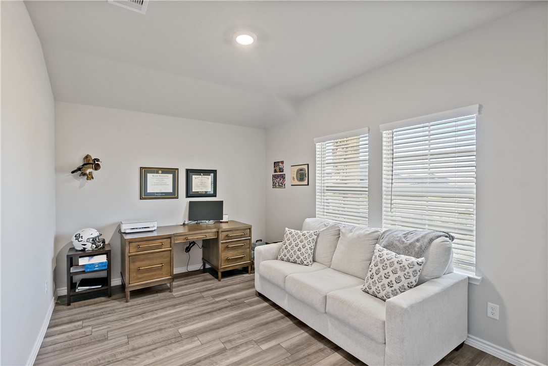 2135 Chief Street Bryan, TX 77807 - Photo 19 of 26 a living room with stainless steel appliances furniture and a window