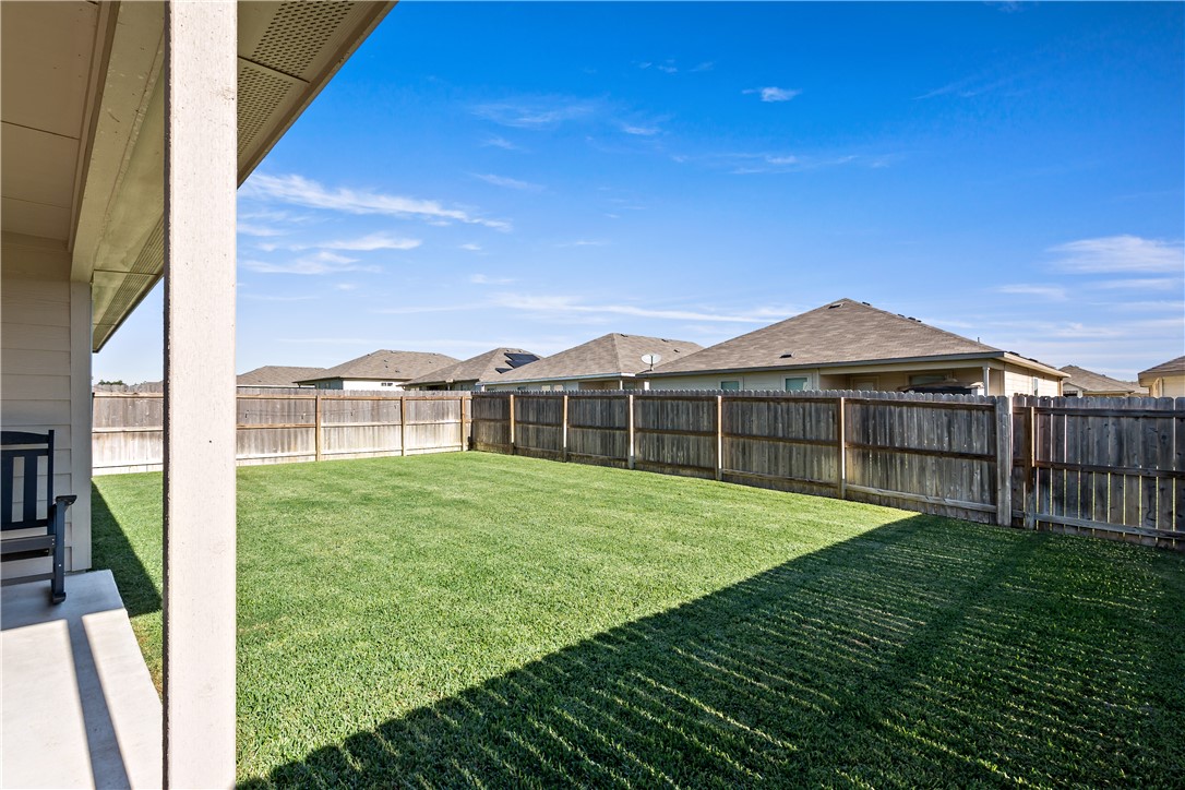 2135 Chief Street Bryan, TX 77807 - Photo 23 of 26 a view of a house with backyard and porch