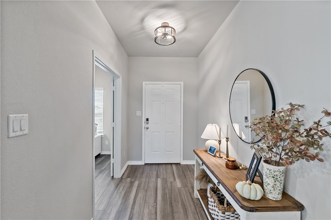 2135 Chief Street Bryan, TX 77807 - Photo 4 of 26 a view of front door with wooden floor