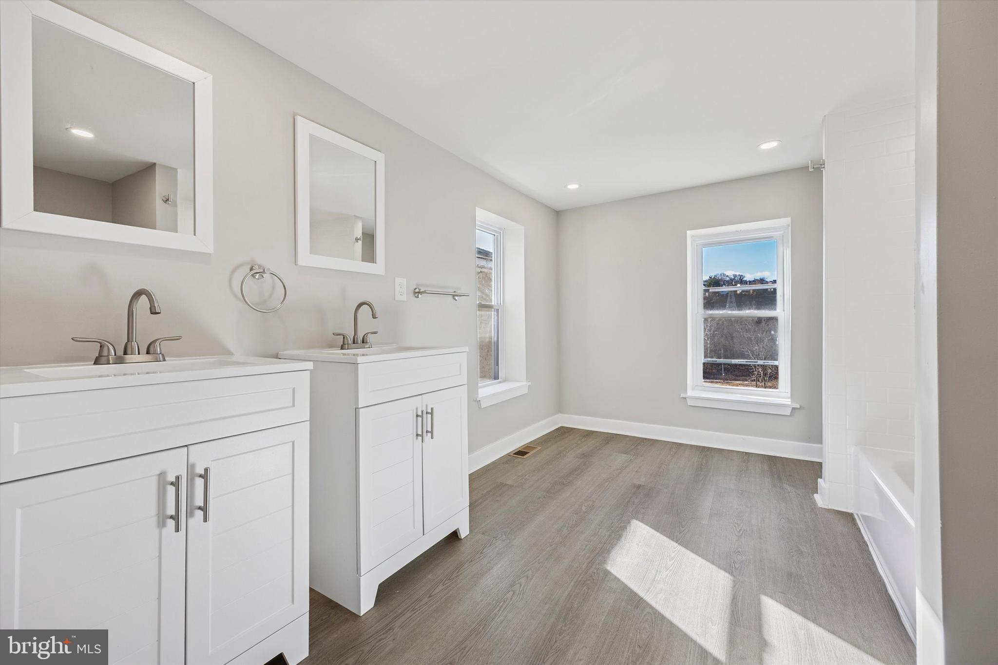 4666 Canton Street Philadelphia, PA 19127 - Photo 21 of 35 a bathroom with a double vanity sink and mirror