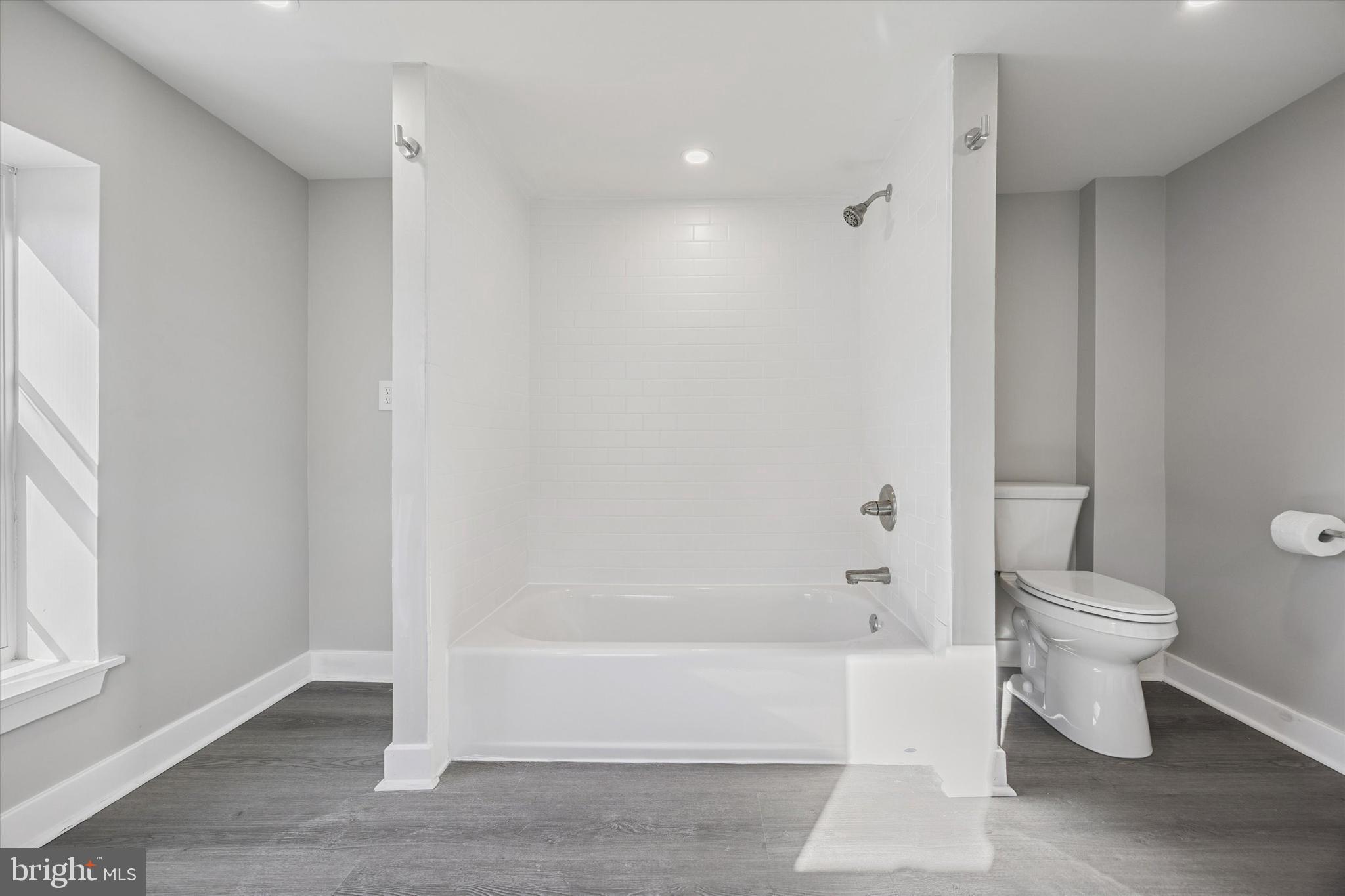 4666 Canton Street Philadelphia, PA 19127 - Photo 24 of 35 a bathroom with a white toilet and bathtub