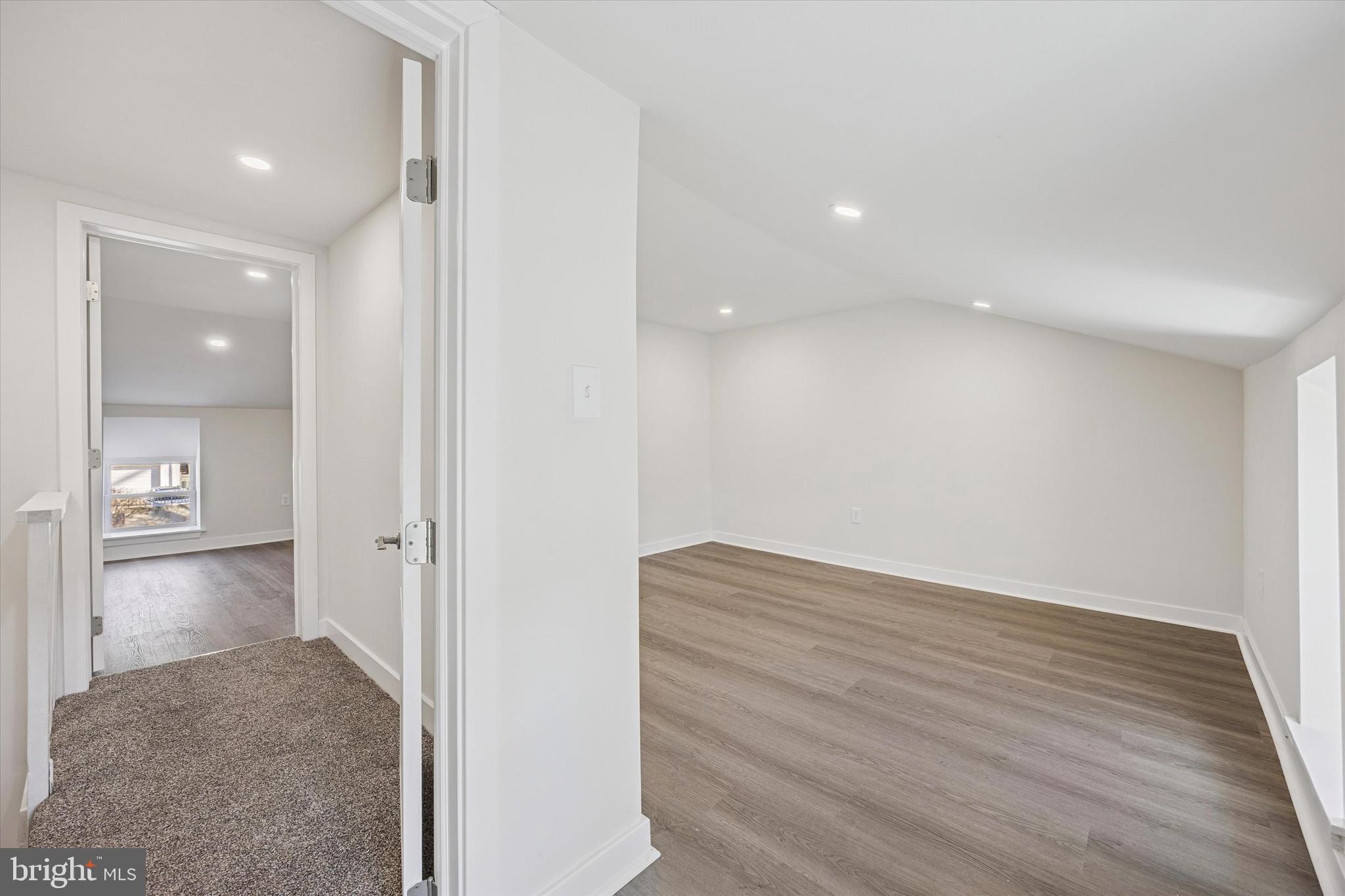 4666 Canton Street Philadelphia, PA 19127 - Photo 29 of 35 a view of empty room with wooden floor and kitchen