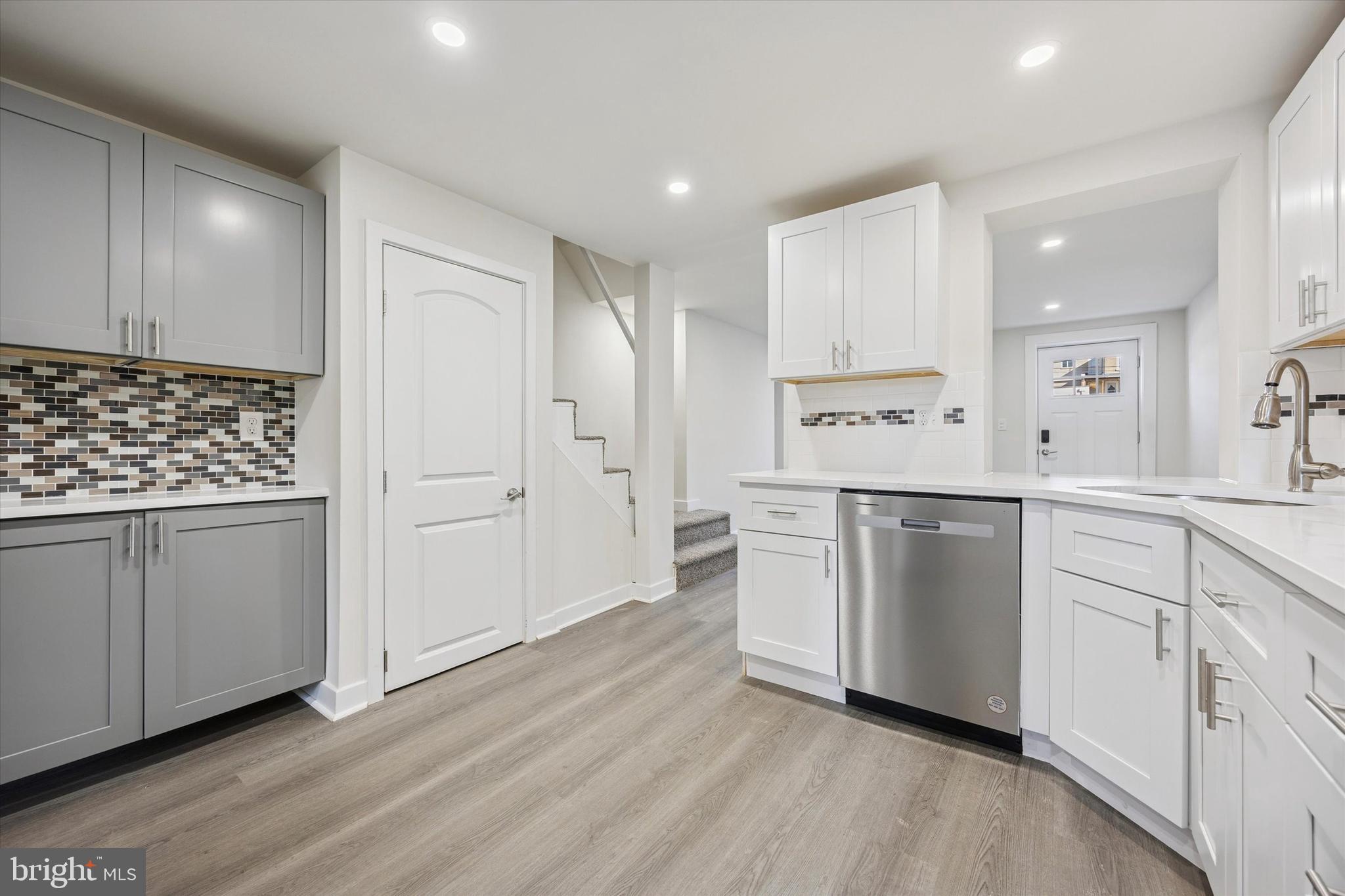 4666 Canton Street Philadelphia, PA 19127 - Photo 8 of 35 a kitchen with white cabinets and white appliances