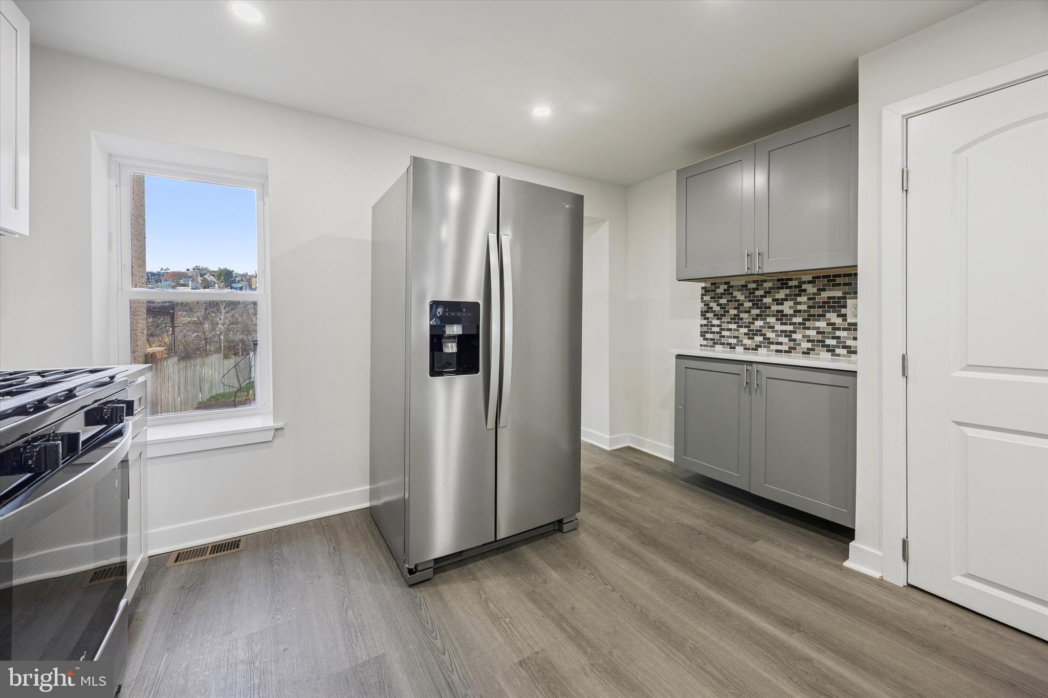 4666 Canton Street Philadelphia, PA 19127 - Photo 9 of 35 a kitchen with stainless steel appliances a refrigerator and a stove top oven