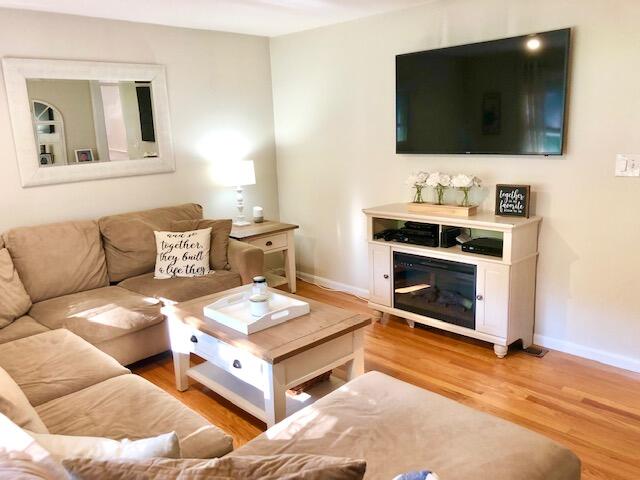 75 Tanbark Road Marstons Mills, MA 02648 - Photo 14 of 40 a living room with furniture and a flat screen tv