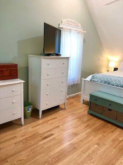 75 Tanbark Road Marstons Mills, MA 02648 - Photo 19 of 40 a bedroom with a bed and a flat tv screen on dresser