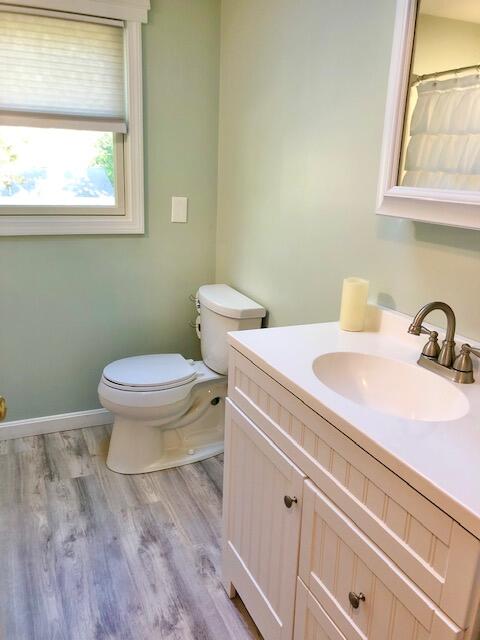 75 Tanbark Road Marstons Mills, MA 02648 - Photo 22 of 40 a bathroom with a sink a toilet and a window