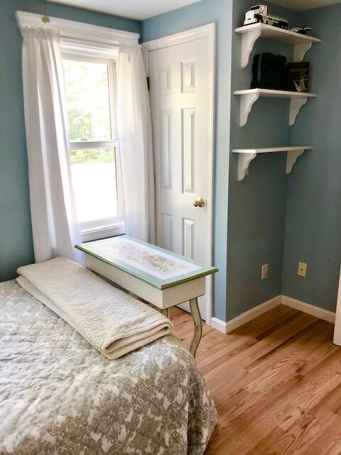 75 Tanbark Road Marstons Mills, MA 02648 - Photo 25 of 40 a bedroom with a bed and cabinets
