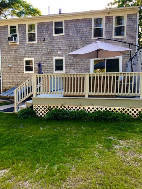 75 Tanbark Road Marstons Mills, MA 02648 - Photo 35 of 40 a front view of a house with a garden