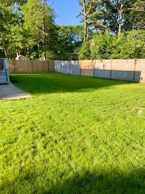 75 Tanbark Road Marstons Mills, MA 02648 - Photo 36 of 40 a view of a backyard with a garden