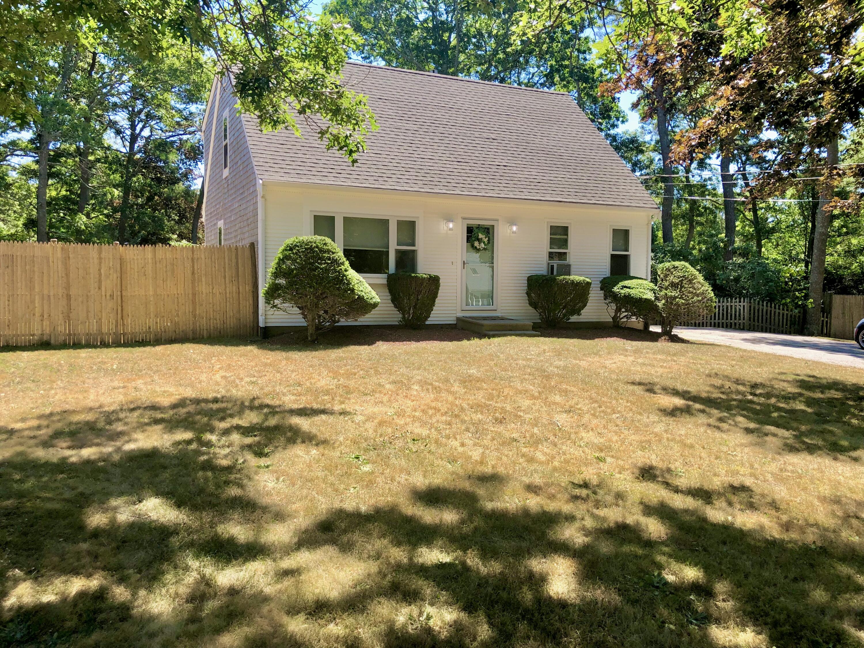 75 Tanbark Road Marstons Mills, MA 02648 - Photo 39 of 40 a view of a house with a patio