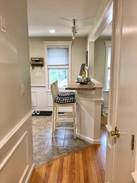 75 Tanbark Road Marstons Mills, MA 02648 - Photo 9 of 40 a kitchen with a table chairs refrigerator and cabinets