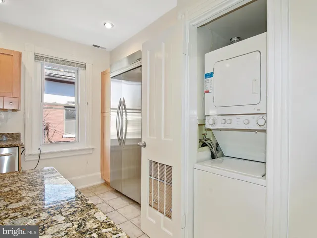 a hallway with washer and dryer