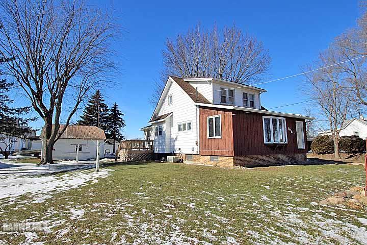 898 North Henderson Road Freeport, IL 61032 - Photo 1 of 19 a front view of a house with a yard covered with snow