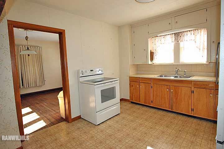 898 North Henderson Road Freeport, IL 61032 - Photo 11 of 19 a view of a kitchen with stove and cabinet
