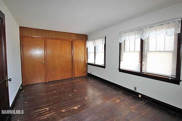 898 North Henderson Road Freeport, IL 61032 - Photo 12 of 19 a view of an empty room with wooden floor and a window