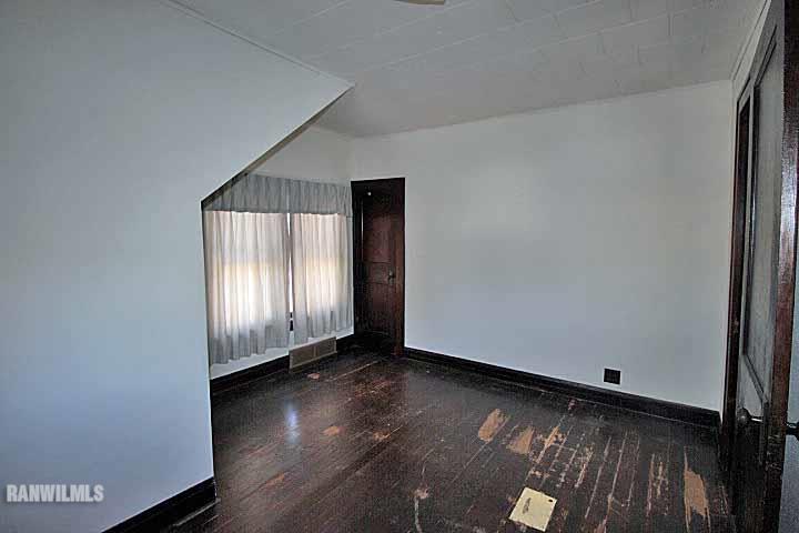 898 North Henderson Road Freeport, IL 61032 - Photo 15 of 19 an empty room with wooden floor and windows