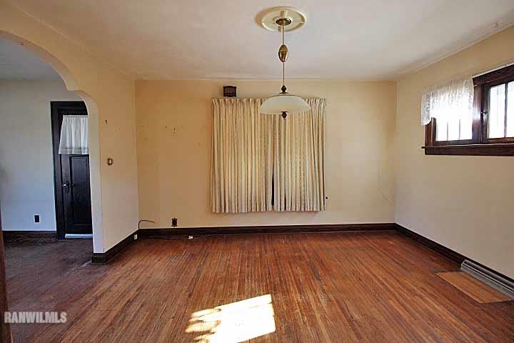 898 North Henderson Road Freeport, IL 61032 - Photo 7 of 19 a view of empty room with wooden floor
