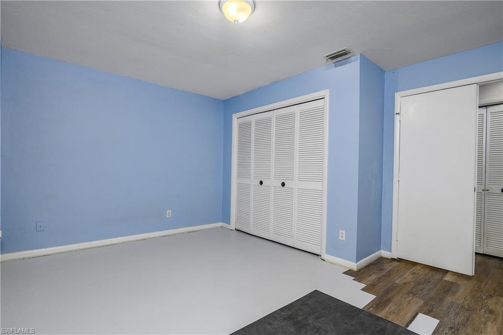 191 Round Key Circle, Unit D2 Naples, FL 34112 - Photo 19 of 24 an empty room with closet area