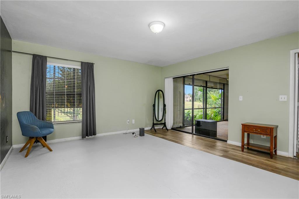 191 Round Key Circle, Unit D2 Naples, FL 34112 - Photo 21 of 24 a view of an empty room with furniture and a window