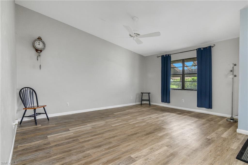 191 Round Key Circle, Unit D2 Naples, FL 34112 - Photo 5 of 24 a view of room with window and wooden floor