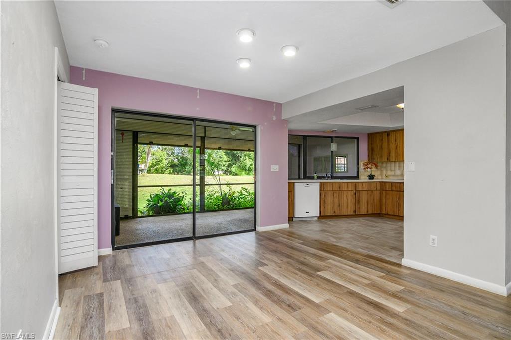 191 Round Key Circle, Unit D2 Naples, FL 34112 - Photo 9 of 24 a view of a hallway with a kitchen