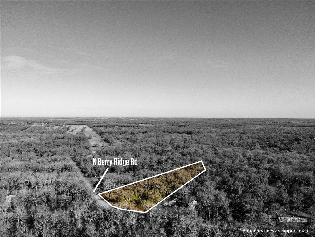 an aerial view of house with yard