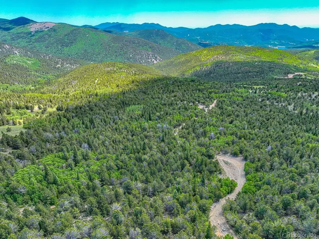 a view of an ocean from a mountain