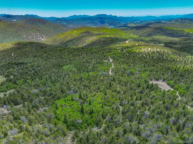 a view of an ocean and a mountain