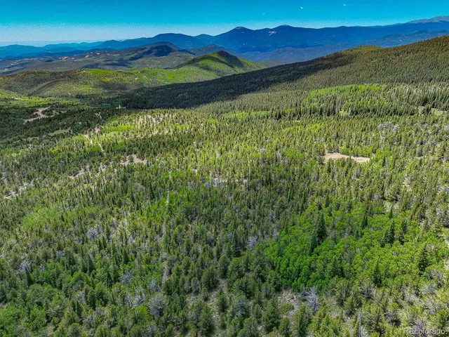 a view of an outdoor space and a mountain