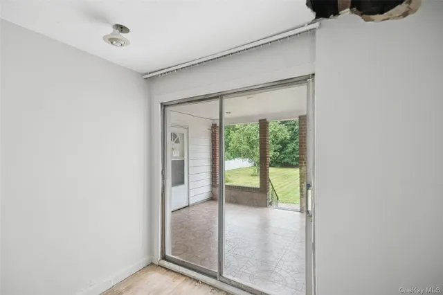 a view of a room that has a large window