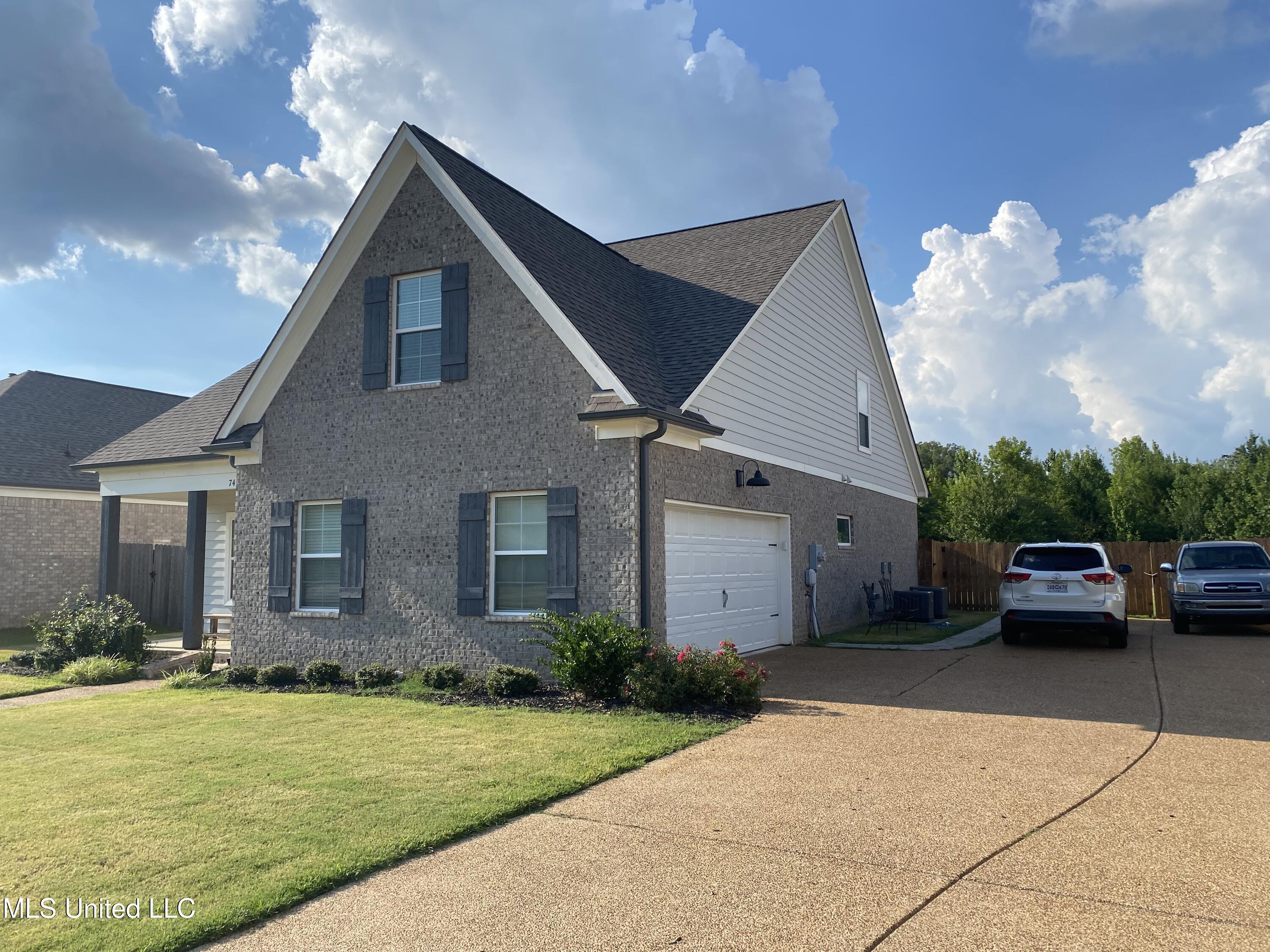 7414 Crosswinds Boulevard Hernando, MS 38632 - Photo 2 of 28 side with garage