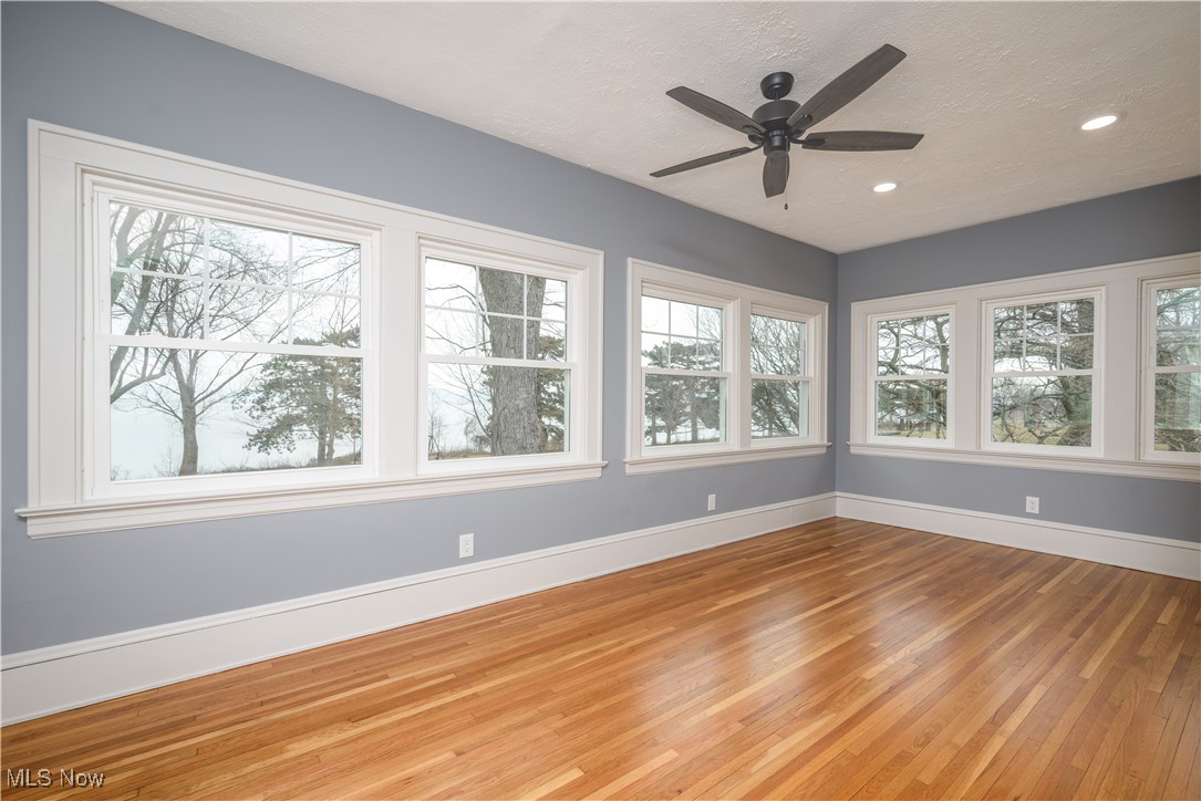 17728 Windward Road Cleveland, OH 44119 - Photo 21 of 32 Unfurnished sunroom featuring ceiling fan