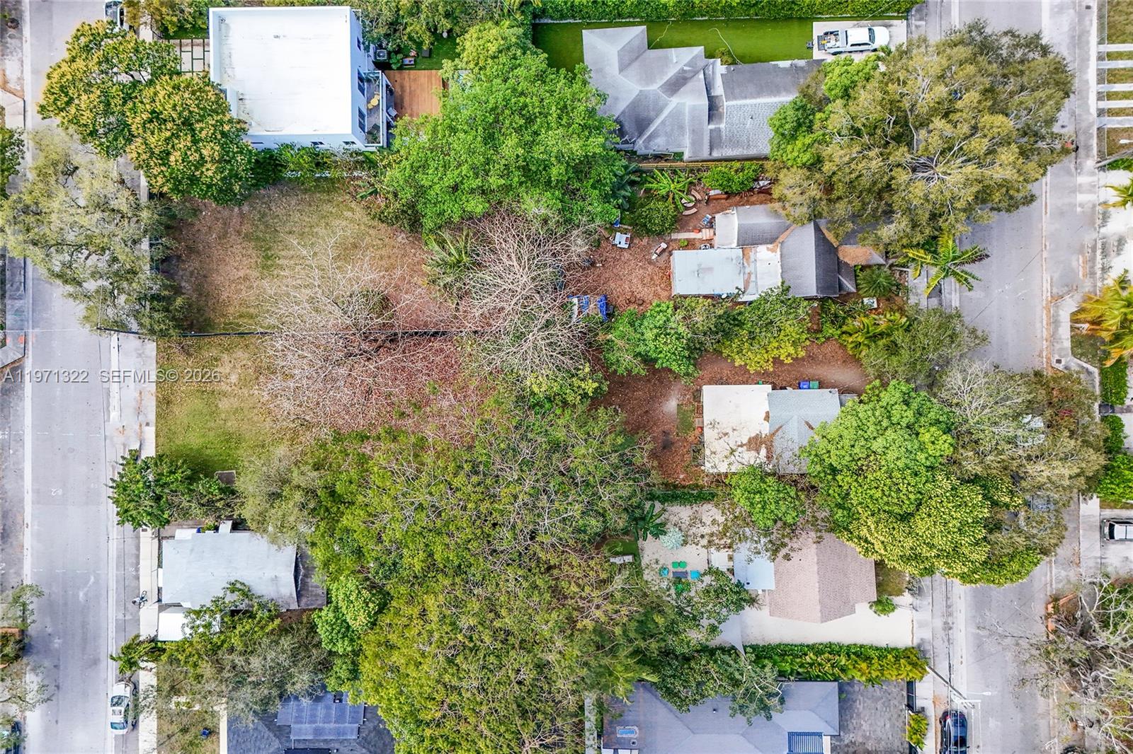 3544 William Avenue Miami, FL 33133 - Photo 7 of 13 an aerial view of a house with a yard and garden