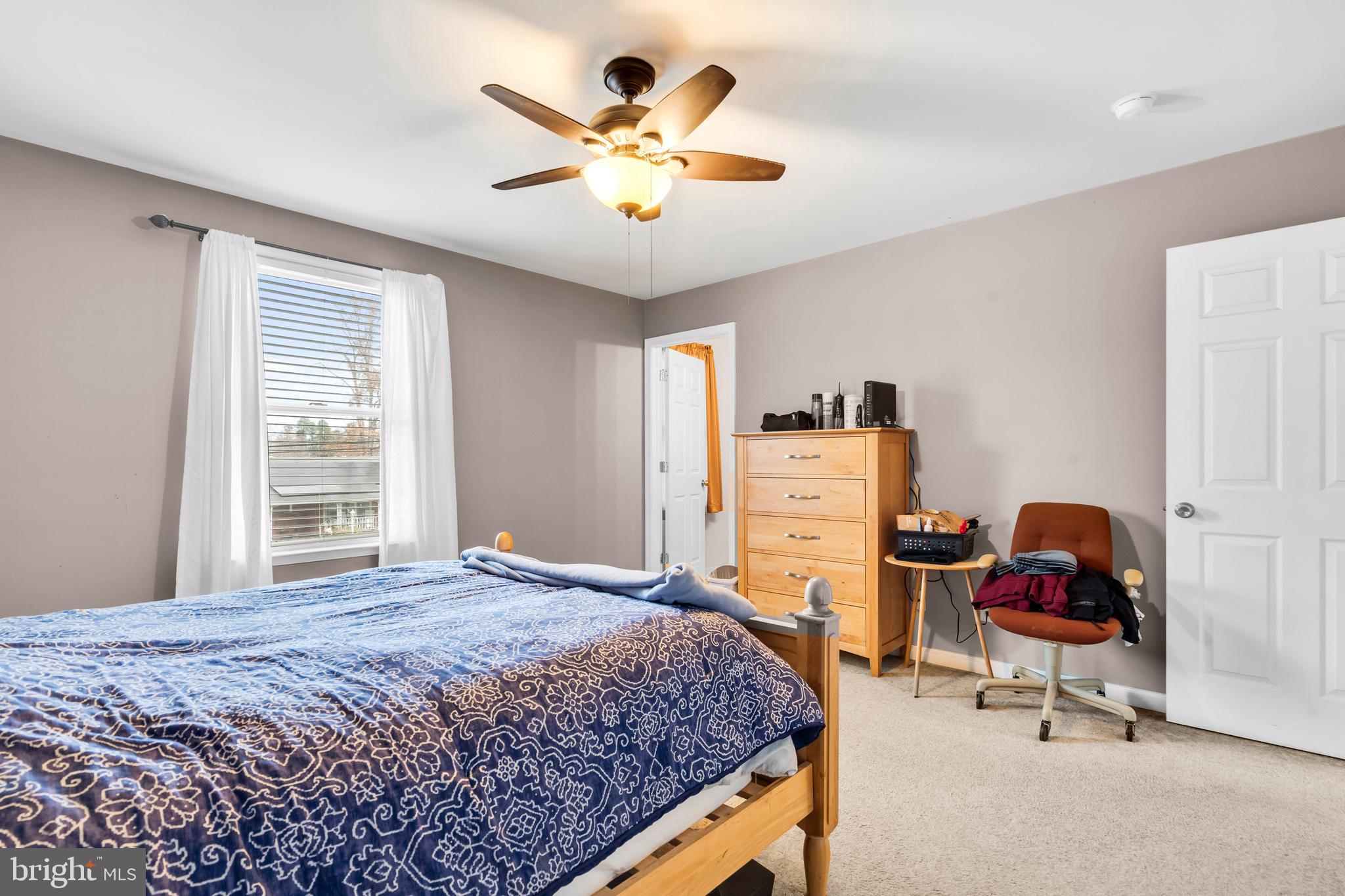 470 Wilson Avenue Lindenwold, NJ 08021 - Photo 13 of 38 a bedroom with a bed and a chandelier