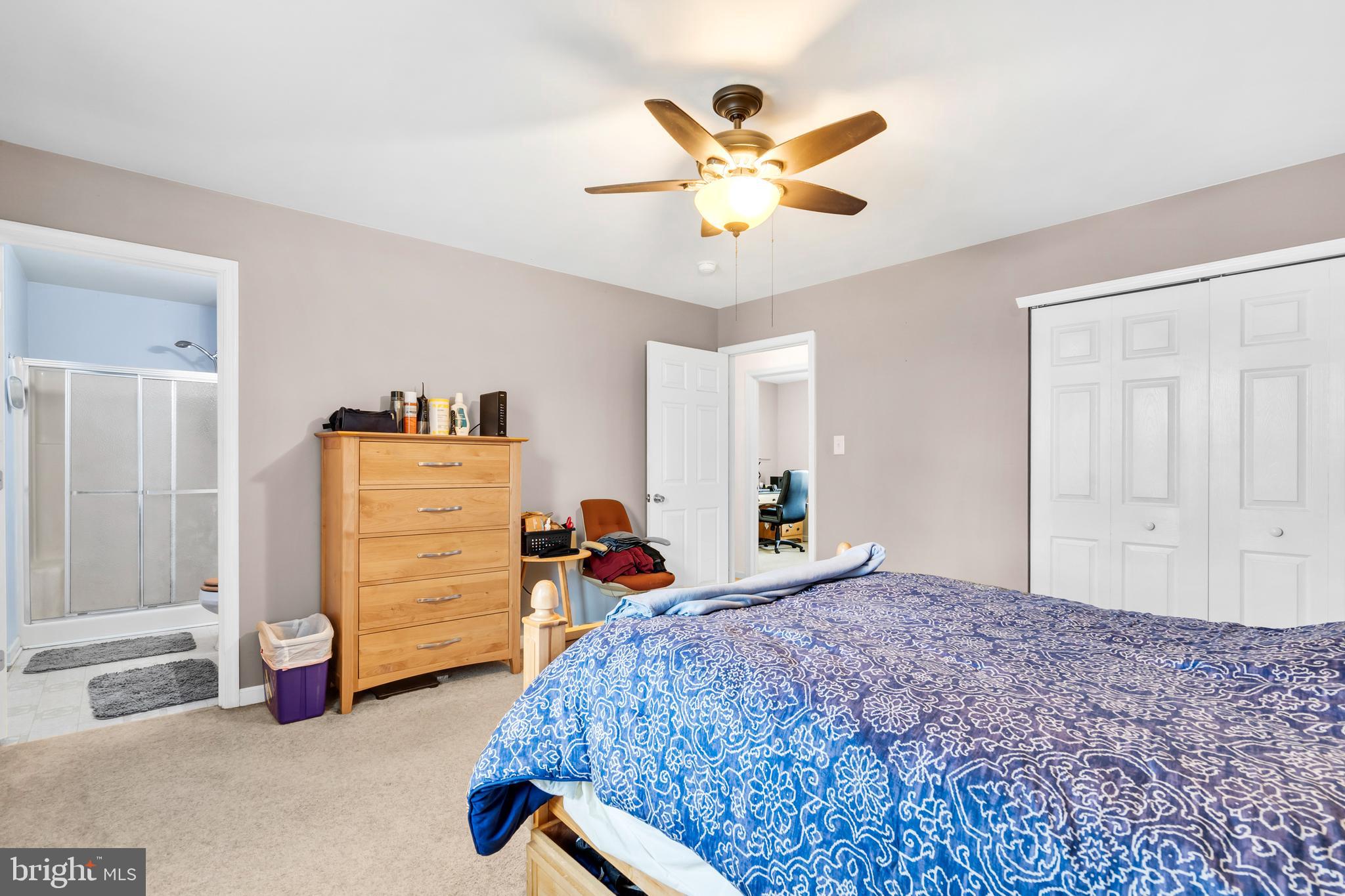 470 Wilson Avenue Lindenwold, NJ 08021 - Photo 14 of 38 a bedroom with a bed and a chandelier