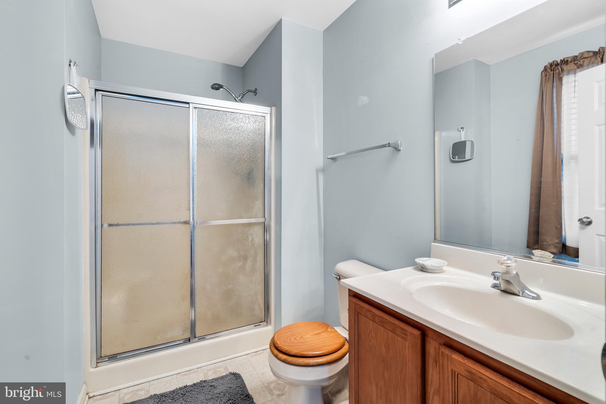 470 Wilson Avenue Lindenwold, NJ 08021 - Photo 15 of 38 a bathroom with a sink toilet and a mirror