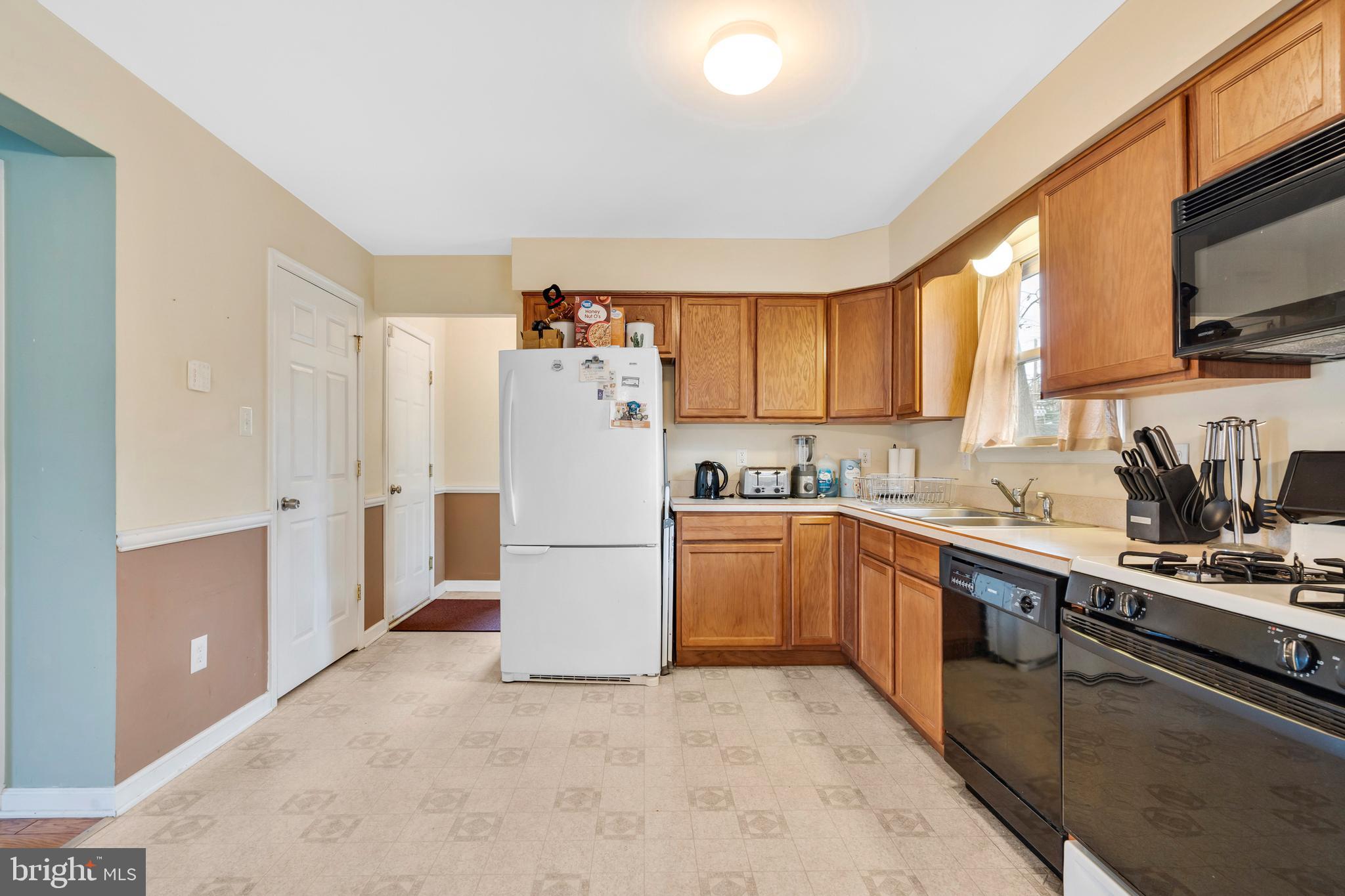 470 Wilson Avenue Lindenwold, NJ 08021 - Photo 3 of 38 a kitchen with stainless steel appliances a refrigerator sink and cabinets