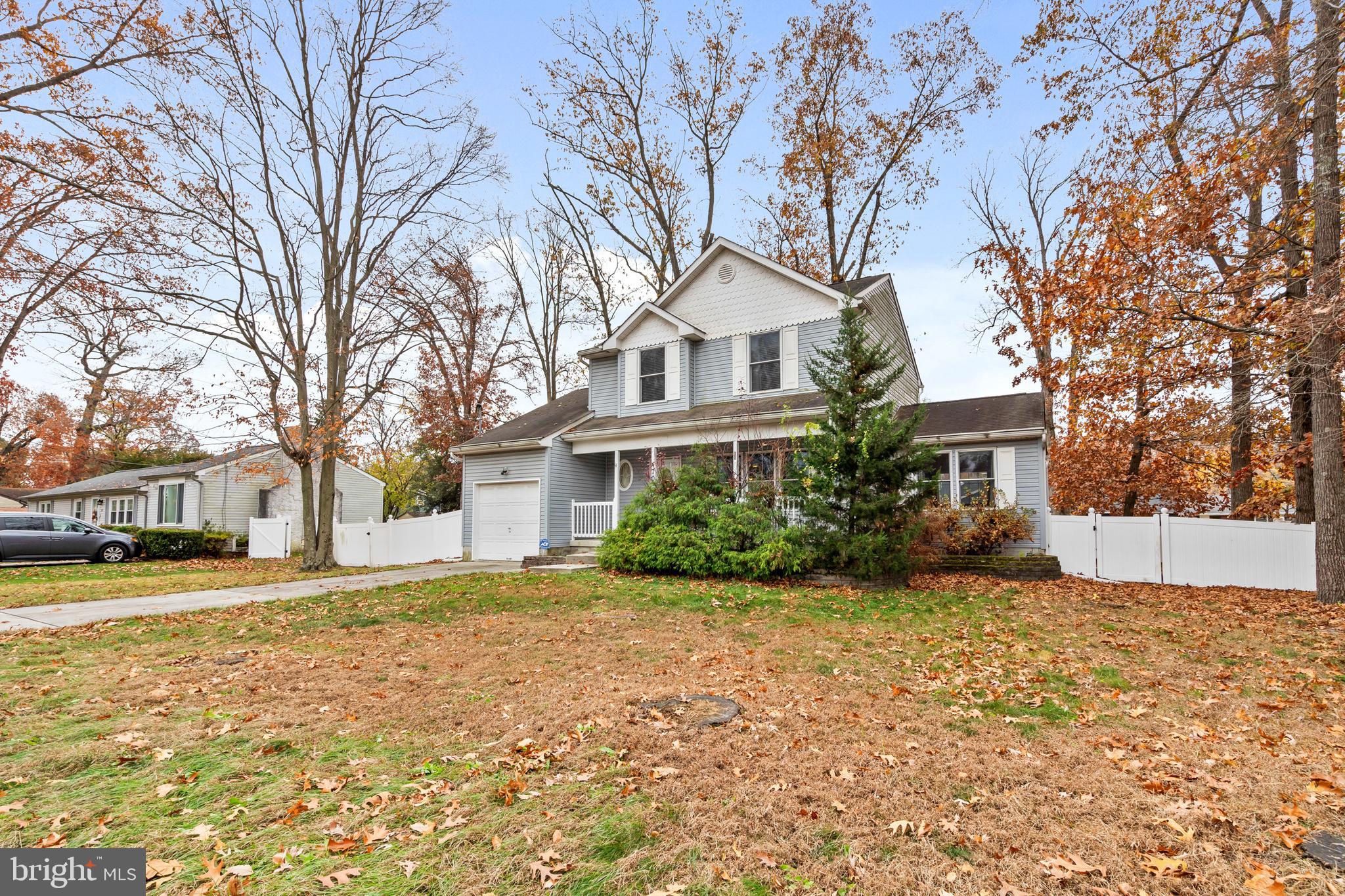 470 Wilson Avenue Lindenwold, NJ 08021 - Photo 32 of 38 a front view of a house with a yard and trees
